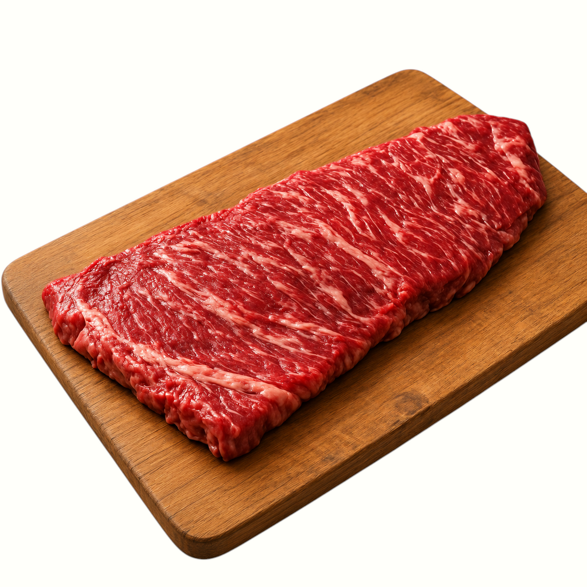 New Soul raw skirt steak from White Sand Homestead on a wooden cutting board, showing rich marbling and deep red color.