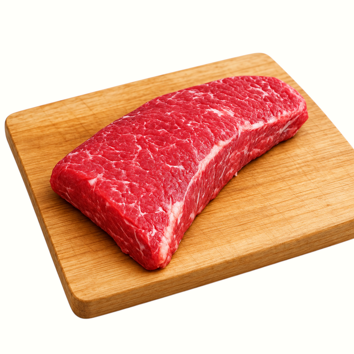 New Soul grass-fed tri-tip steak on a wooden cutting board, showcasing fresh raw beef with rich marbling.