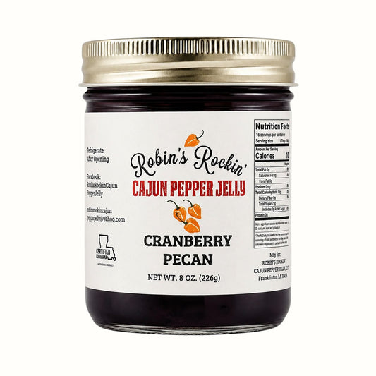 New Soul Robin's Rockin' cranberry pecan pepper jelly in a glass jar with a gold lid and white label.