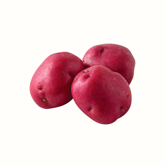 Three fresh red potatoes from New Soul, featuring smooth skins and firm texture, perfect for roasting or boiling.