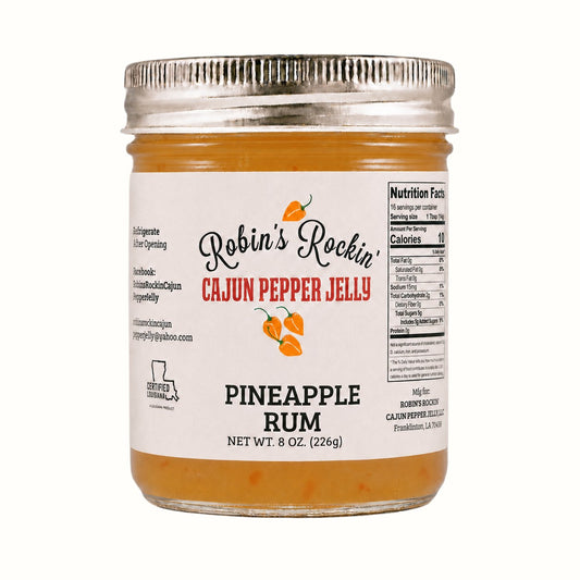 New Soul Robin's Rockin' pineapple rum cajun pepper jelly in an 8 oz glass jar with nutrition label