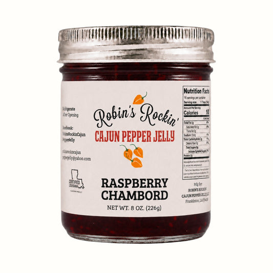 New Soul Robin's Rockin' Raspberry Chambord pepper jelly in a glass jar with a metal lid and white label.